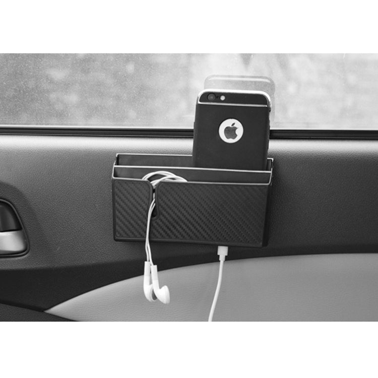 Car organizer pouch with carbon-fiber design, holding smartphone and charging cables