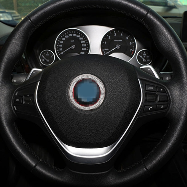 Diamond steering wheel center ring with red inner band on a black steering wheel