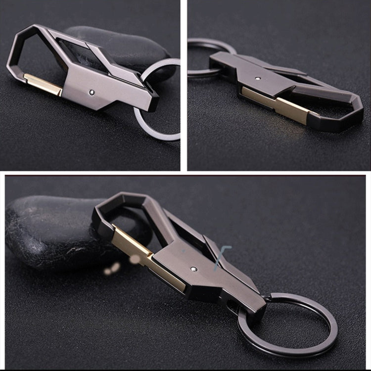 Metal keychain with silver body and gold bar accent, round split ring