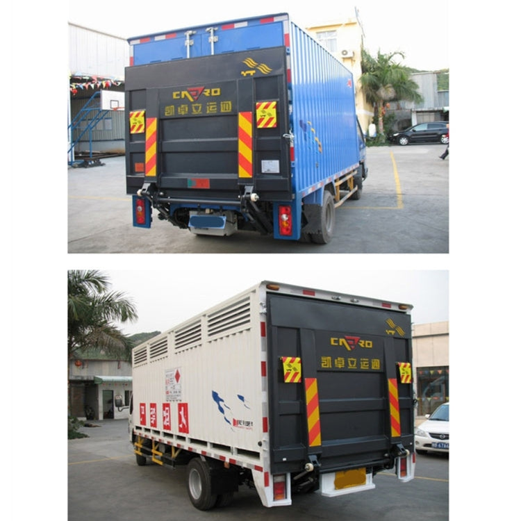 Truck rear with rear warning sign stickers on side doors and panels, reflective chevrons