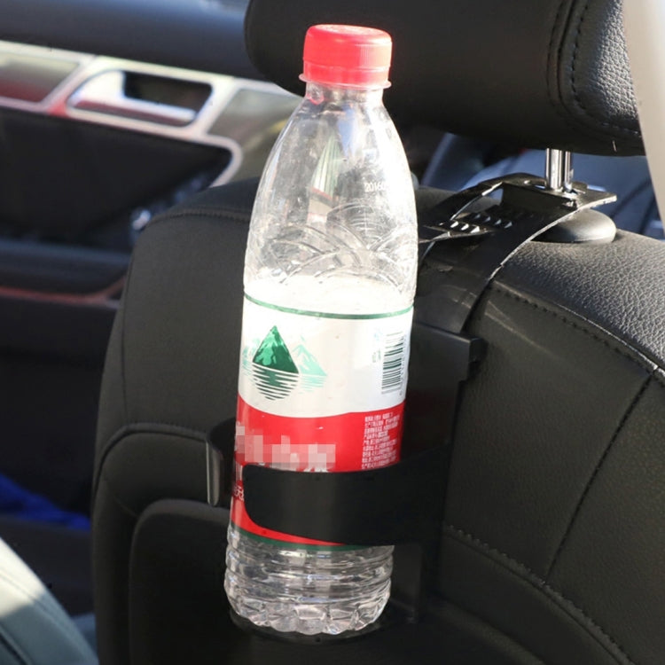Car seatback hanging drink holder holding a clear plastic water bottle