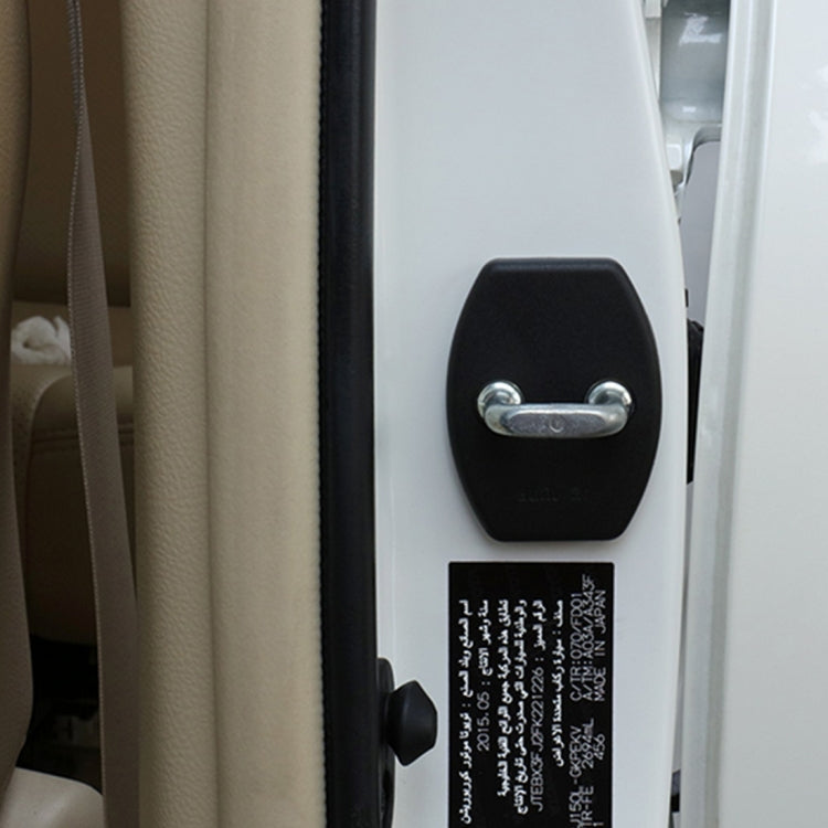 Black car door lock cover installed on vehicle door