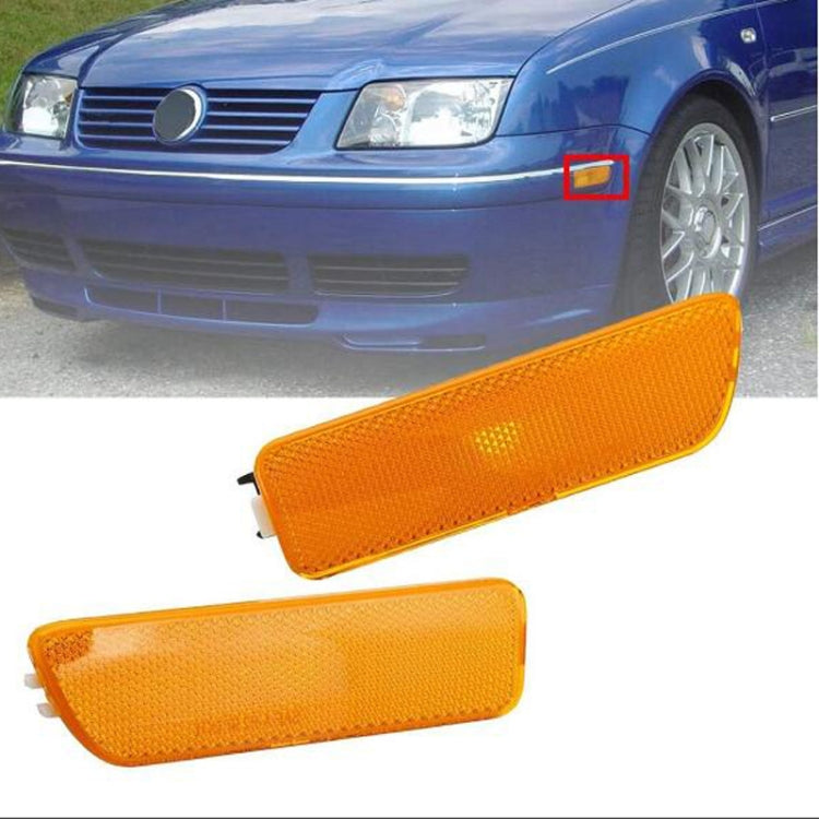 Pair of amber front bumper clearance light housings with textured lens and tabs