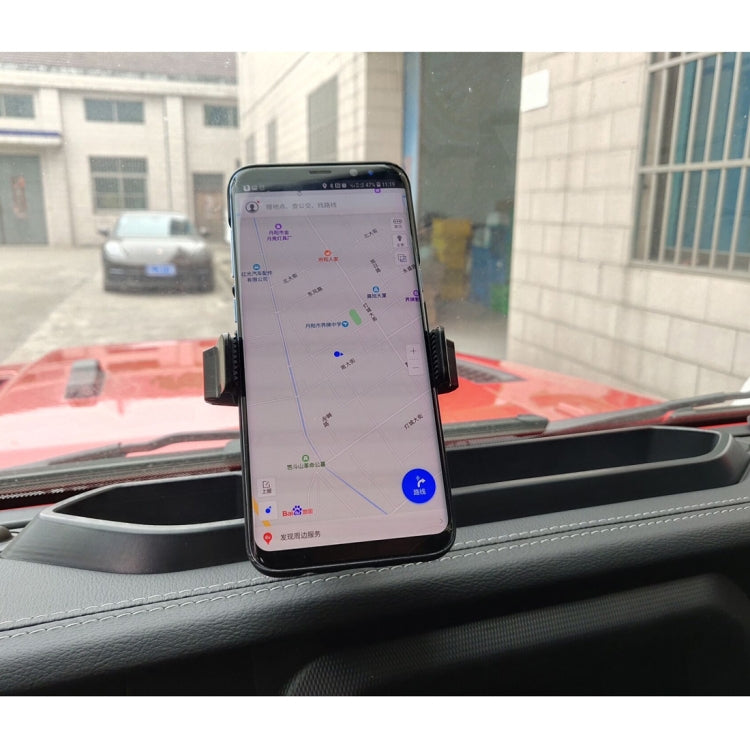 Car GPS dashboard phone mount holder securing a smartphone on the dashboard