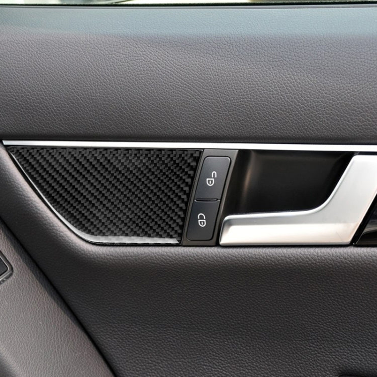 Carbon fiber seat adjustment panel sticker; black textured insert on car door panel near controls
