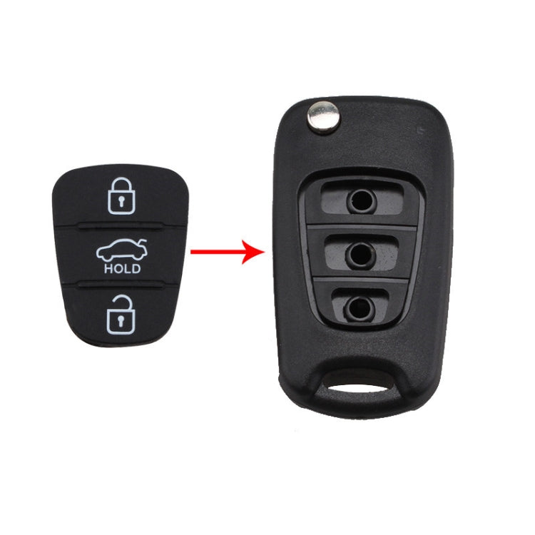 Black silicone key button pad with 3 buttons; arrow shows placement on key shell