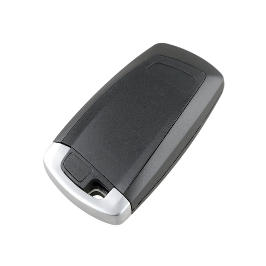 Black car remote key fob with silver bottom edge and side metal key slot