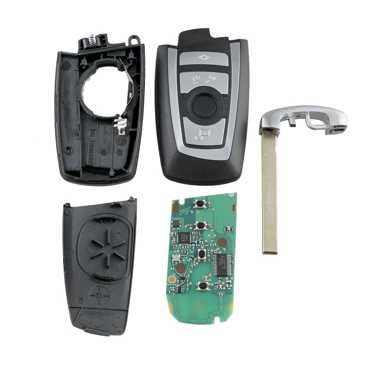 Set of opened black key fob parts with circuit board and metal key blade
