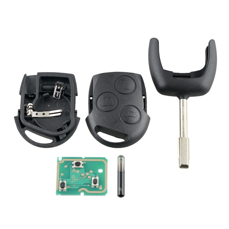 Opened key fob kit with remote shells, circuit board, battery, and metal key