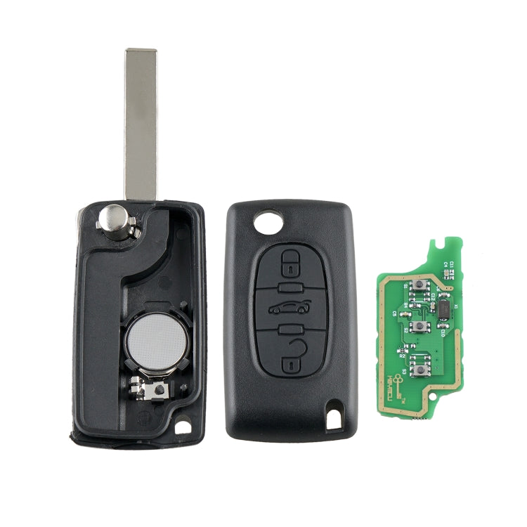 Car key fob set: black shell halves, key blade, and green circuit board