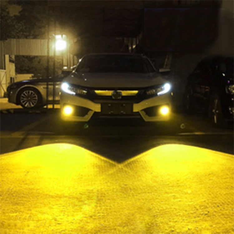 Car front with yellow LED fog lights illuminated near the bumper