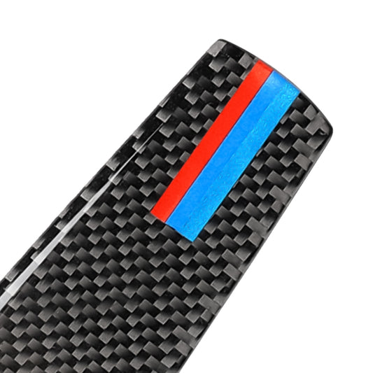 Close-up carbon-fiber steering wheel sticker with blue center and red side stripes