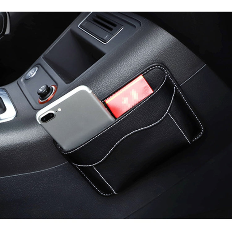 Black car storage organizer bag holding a smartphone and small items on seat.