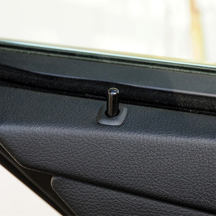 Black car door lock cover cap with round base on door panel