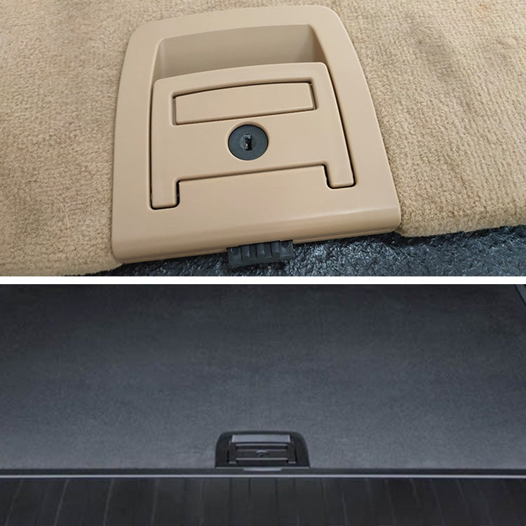 Beige trunk handle cover with circular lock hole on carpet