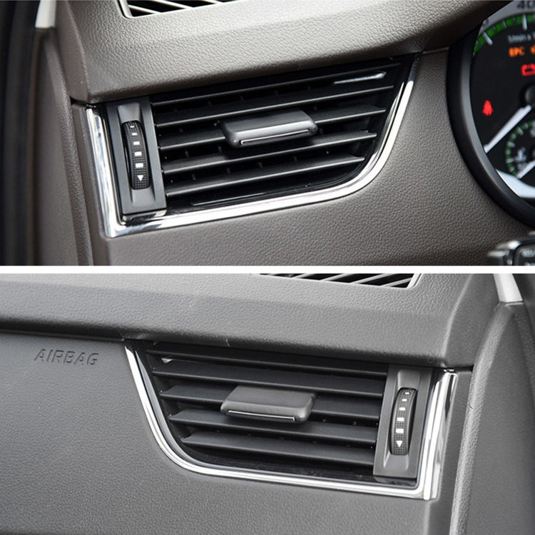 Installed black air vent paddle switch on dashboard vent grille with chrome trim