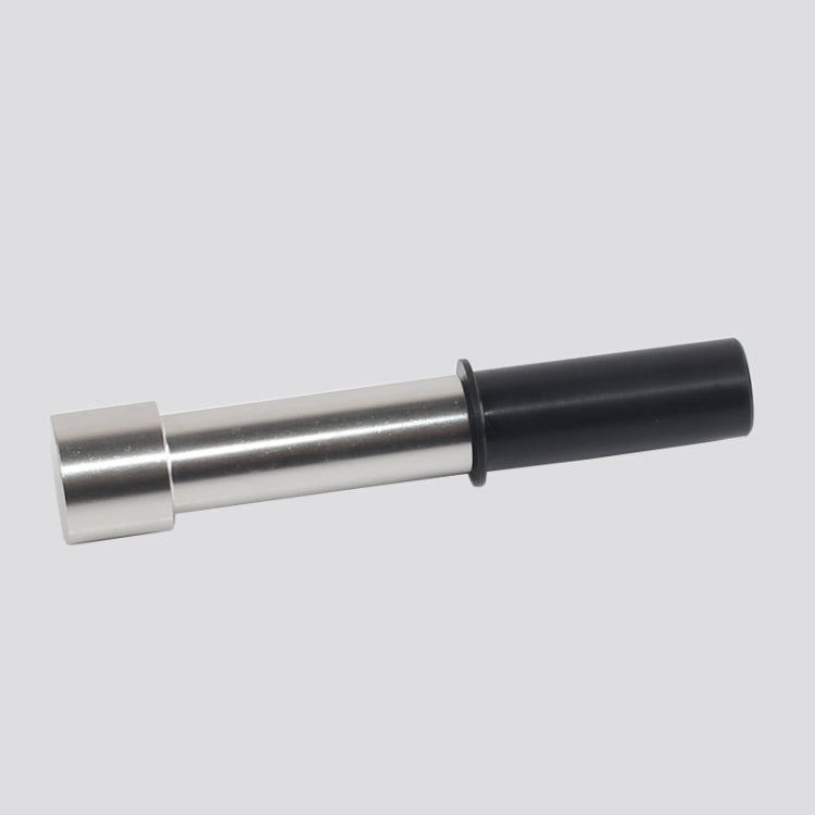Metal installation tool holding a black hinge bushing sleeve