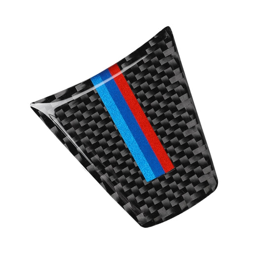 Carbon fiber steering wheel trim sticker with tricolor stripe, angled close-up.