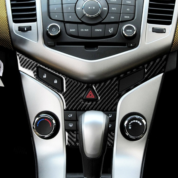 Carbon fiber-look air conditioning trim sticker set around climate controls and hazard triangle