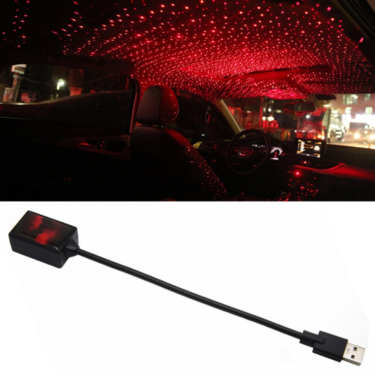USB car rotating star light projector with red dot pattern on dashboard