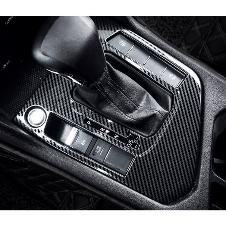 Carbon fiber gear shift panel trim sticker installed around shifter controls