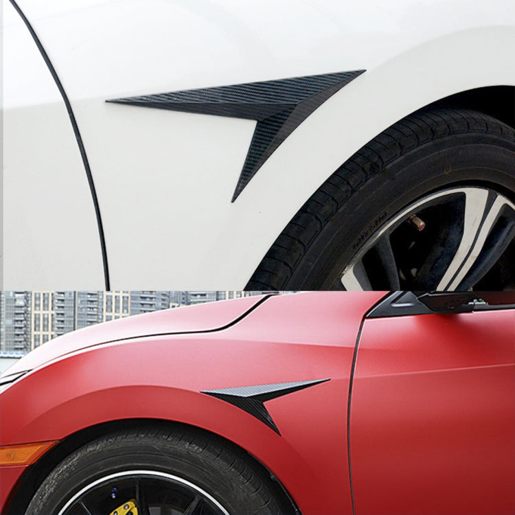Carbon-fiber shark gill side wing decal on red car fender