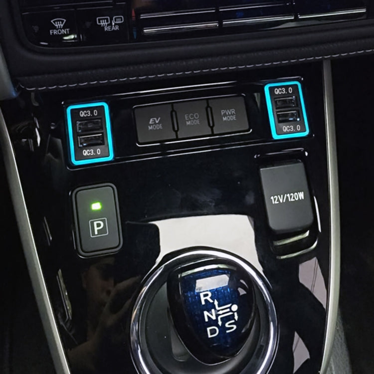 QC3.0 USB charger ports with ice-blue light bezel mounted in vehicle center console