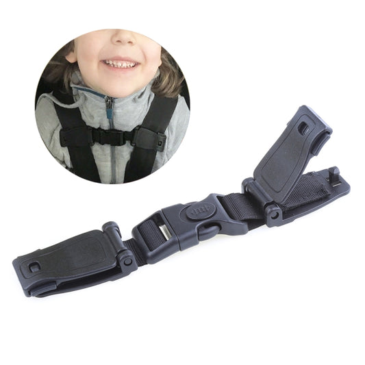 Kids car seat belt adjuster with dark buckle on child safety harness strap