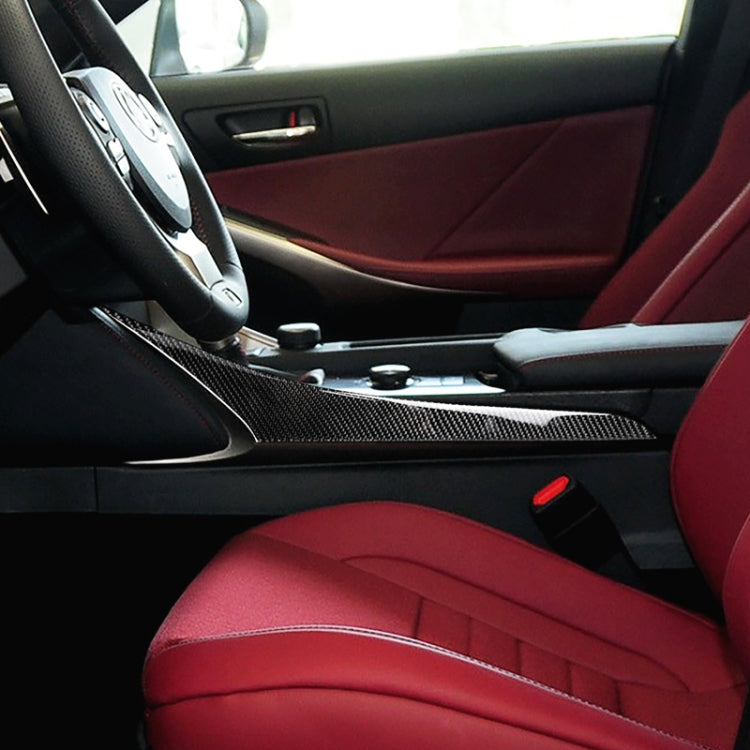Carbon fiber decorative trim strip along car center console near gear area