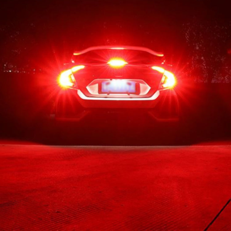 Car strobe brake light emitting bright red glow from the rear lamp area