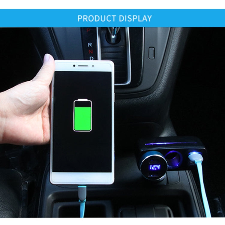 Black dual USB car charger plugged in car socket with phone charging indicator