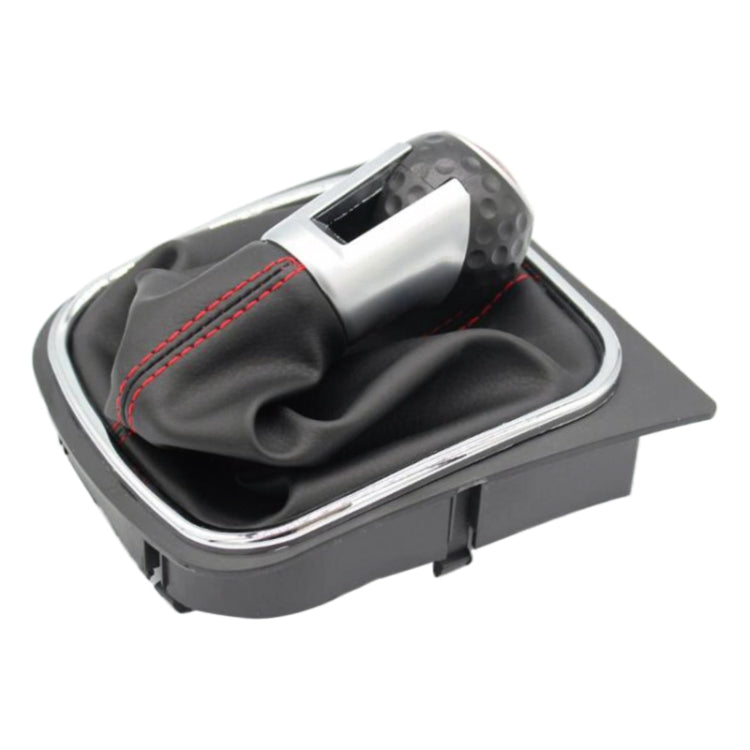 Manual gear shift knob with black leather boot, red seam, silver top, chrome-trim surround