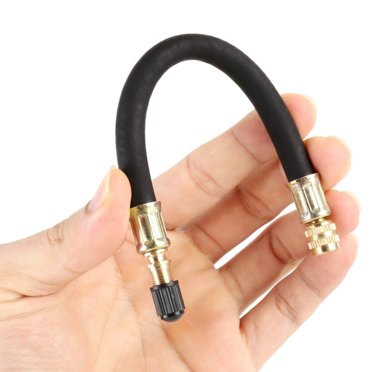 Car vacuum extension tube ends in hand, black hose with brass valve fitting