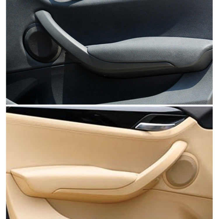 Interior door handle trim set in black and beige, shown on car door panel