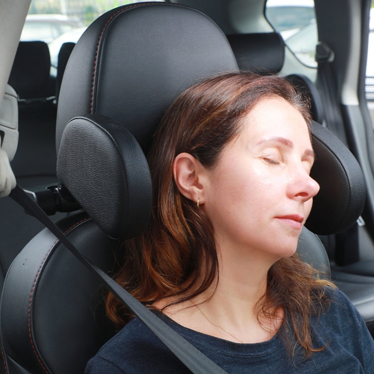 Black U-shaped memory foam car neck rest cushion installed on vehicle headrest