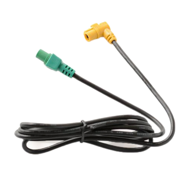 Car audio cable with green plug and yellow jack, coiled black cord