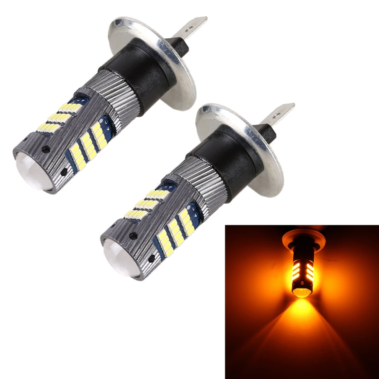H1 LED fog light bulb pair with warm amber light glow