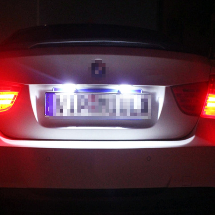 Blue LED license plate lights illuminating a car rear license plate