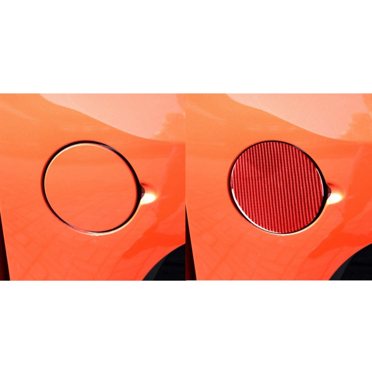 Two fuel openings; right has red carbon-fiber circular sticker with black rim