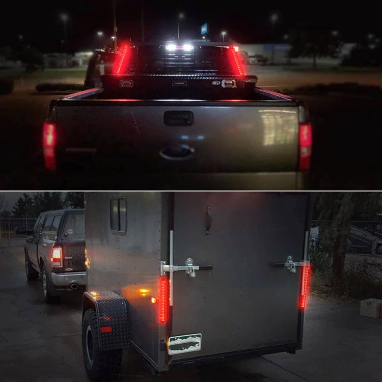 Rear-mounted LED tail light bar glowing red brake and amber turn signals on vehicle.