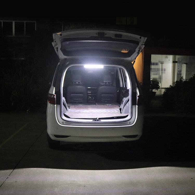 COB LED dome light brightens open car trunk interior from overhead