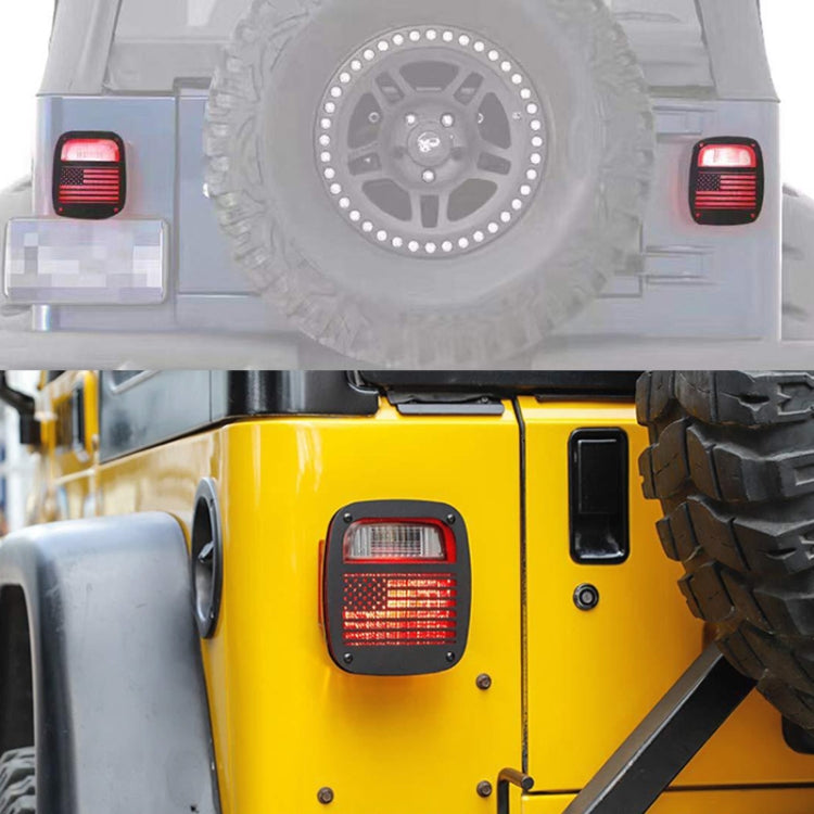 Jeep rear with black tail light trim covers showing red grid lights