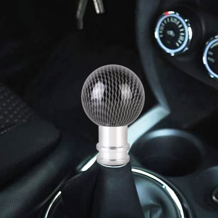 Car gear shift knob with black carbon fiber textured ball top and silver metal base