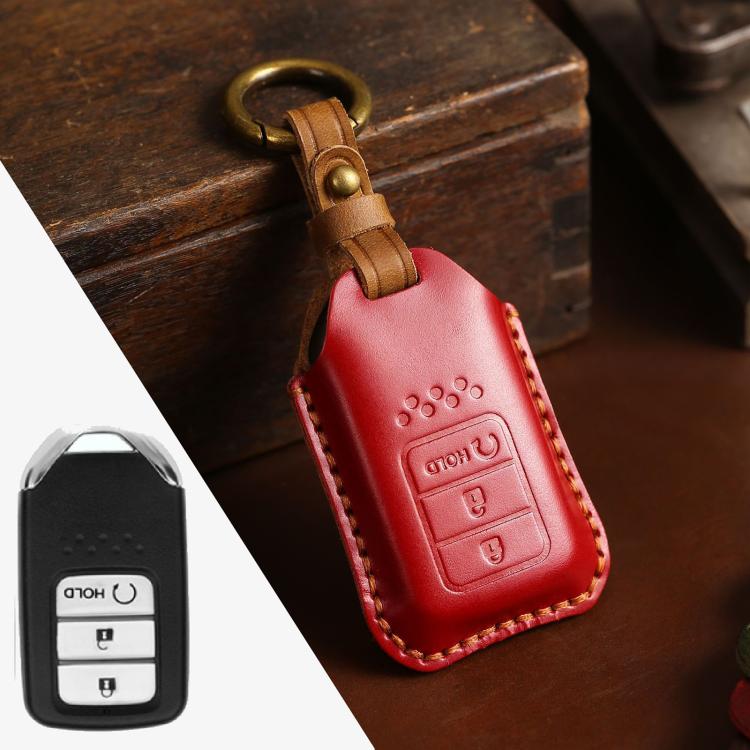Red leather key fob protective cover with stitched edges and metal keyring loop