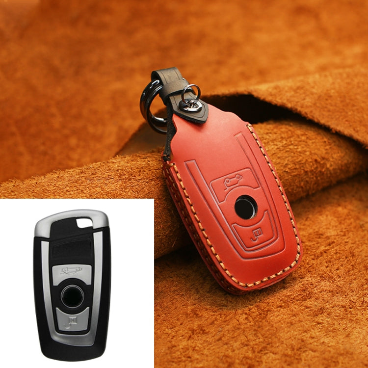 Red leather key protective cover with keyring loop and stitched remote button panel
