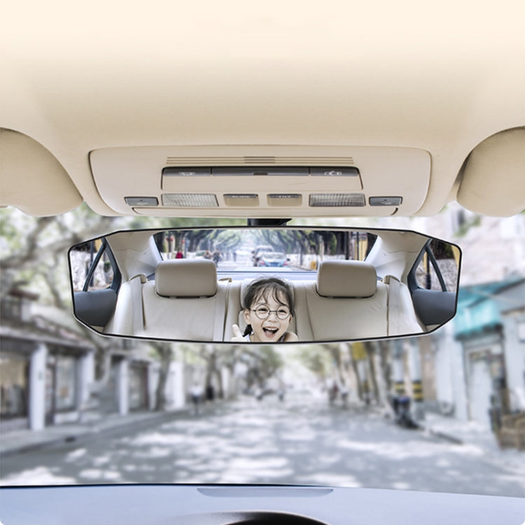 Car interior rear-view mirror with anti-glare lens showing street scene