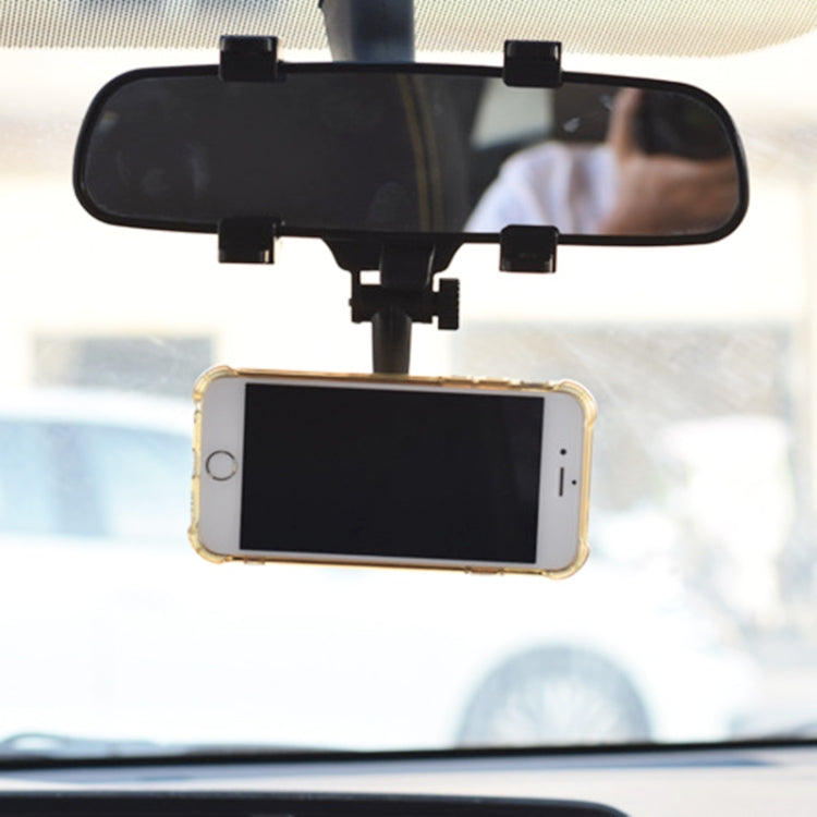 Rearview mirror phone holder holding a smartphone in landscape orientation