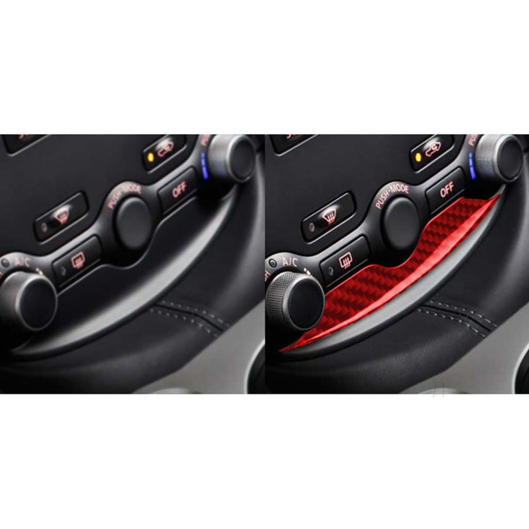 Red carbon-fiber trim insert on car center console climate controls