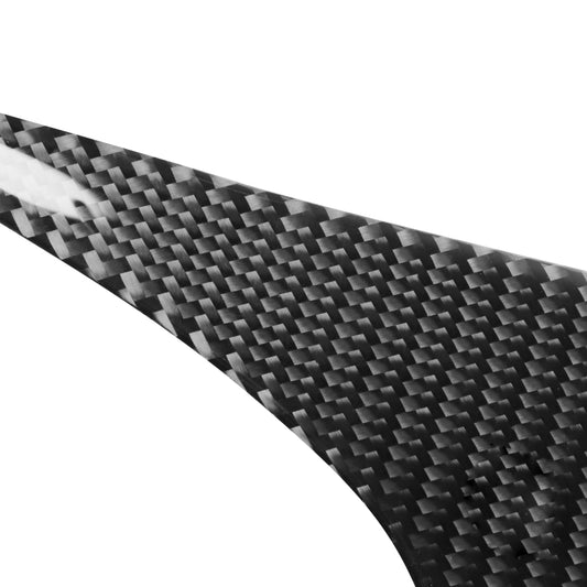 Close-up of black carbon fiber weave texture on a curved headlight eyebrow sticker