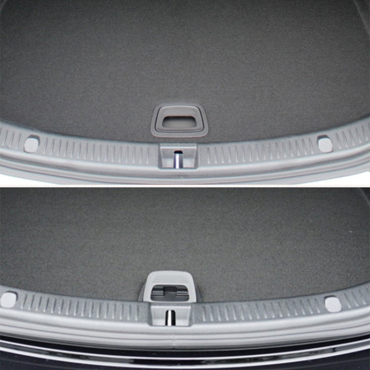 Trunk release handle on rear bumper trim, silver strip with dark gray insert